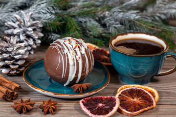 Cup of coffee and dessert among the Christmas decorations. Celebrating Christmas and New Years. Home comfort.