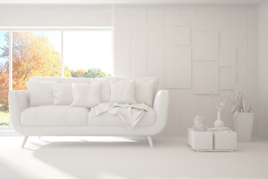 Stylish room in white color with sofa and autumn landscape in window. Scandinavian interior design. 3D illustration