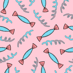 Modern cartoon seamless pattern with pink and blue candies and serpentine on pink background. Christmas doodle pattern with candies. Abstract bright wallpaper. Christmas abstract pattern
