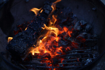 Barbecue flaming Charcoal Grill close up photo. Cooking outdoor. Beautiful flames of fire. 