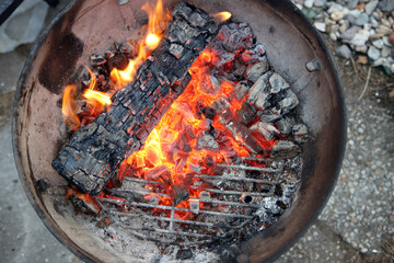 Barbecue flaming Charcoal Grill close up photo. Cooking outdoor. Beautiful flames of fire. 