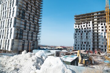 The architectural complex of residential buildings on sky background