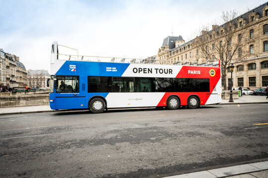 PARIS, FRANCE - February 14, 2018 : Tourist Bus in Paris, France Paris Open Tour is a touristic bus service that shows the city with an audio guide