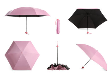 Set with stylish pink umbrellas on white background