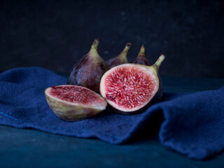 Fresh figs on dark wooden background