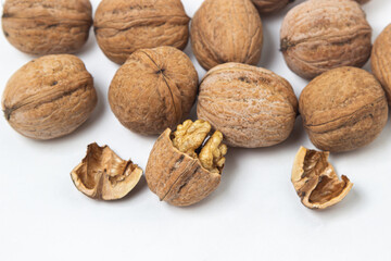 Walnuts on a white background. Chopped walnut.