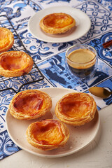 Portugal egg tart Pastel de Nata with azulejo tile pattern traycloth