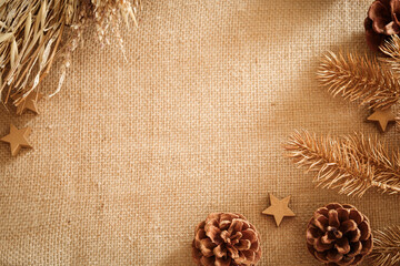 Christmas composition with natural colors and materials. Xmas background. Decoration elements, pine cones. Free space for text, copy space. Flat lay, top view.