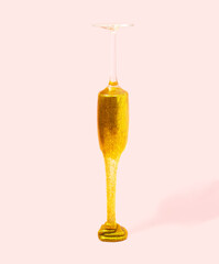 Luxury and golden drink is leaking from wine glass. Creative and bizarre concept.