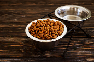 dry food for cats on a wooden background
