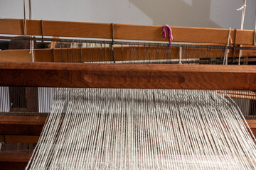 The old loom with yarn