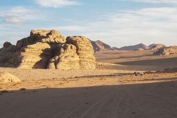 the car rides in the wadi Rum desert, beautiful relief mountains, contrasting shadows, evening, Jordan