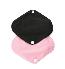 Cloth menstrual pads on white background, top view. Reusable female hygiene product