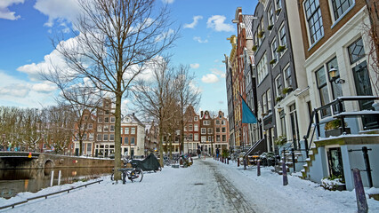 City scenic from snowy Amsterdam in winter in the Netherlands