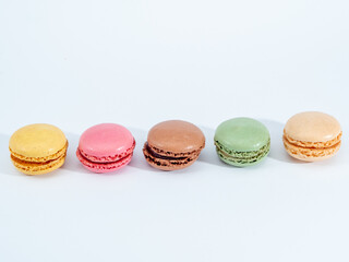 colorful macarons on white background