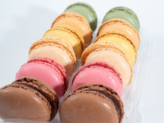 colorful macarons on white background