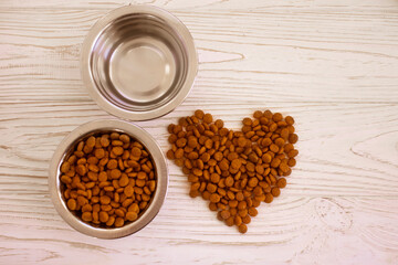 dry food for cats on a wooden background