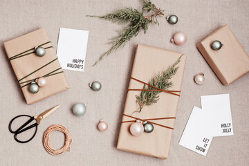 Christmas background with gift boxes wrapped in kraft paper. Xmas celebration, preparation for...