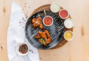 appetizing chicken wings in a plate.