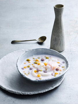 Bour Loi Kai Wan - silky dumplings of Taro with coconut & poached egg