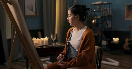 budding artist draws new painting inspired by another masterpiece girl recreates sketch,picks up phone zooms in on photo shrugs shoulders puts phone on easel so she can glance at smartphone - Powered by Adobe