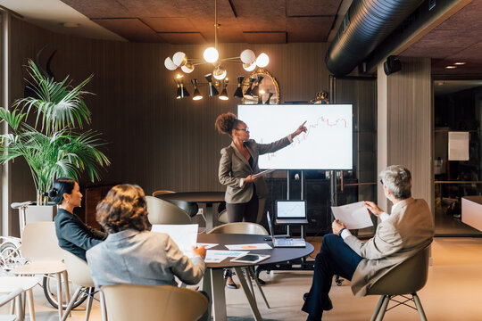 Italy, Businesswoman having presentation in creative studio