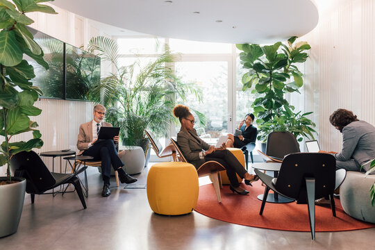 Italy, Business people working in modern creative studio