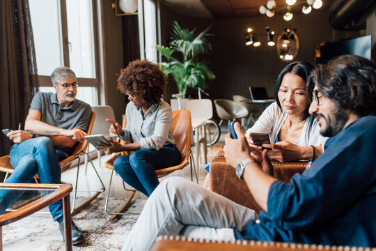 Italy, Business people having meeting in creative studio