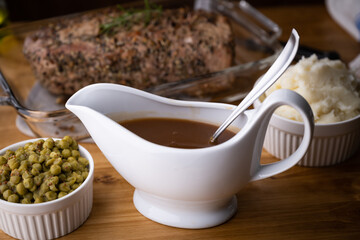 Obraz na płótnie Canvas gravy sauce in sauce pod with mashed potato