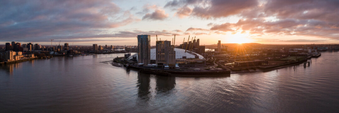UK, London, Aerial view of The O2 and Docklands at dawn
