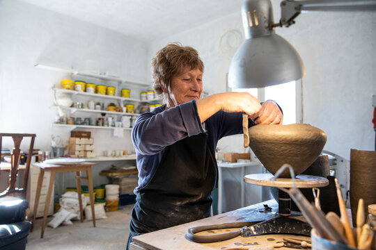 Spain, Baleares, Woman making ceramics in workshop