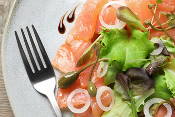 Delicious salmon carpaccio served on table, top view