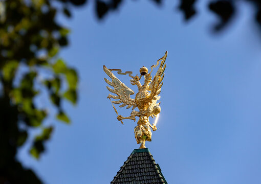 Two-headed Russian eagle as  symbol of statehood against  blue sky.