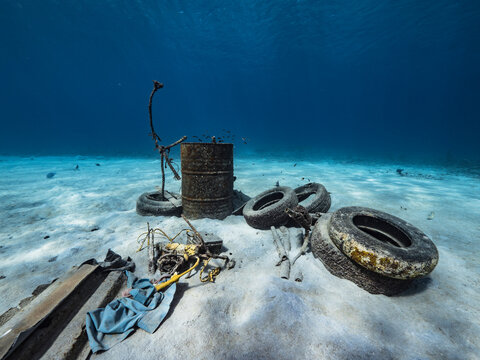 Seascape with trash collection in the shallow water of the coral reef in Caribbean Sea, Curacao