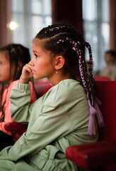 Girl watching movie in cinema with friends