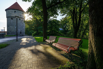 Benches to sit at sunset in a public city park. Tallinn.