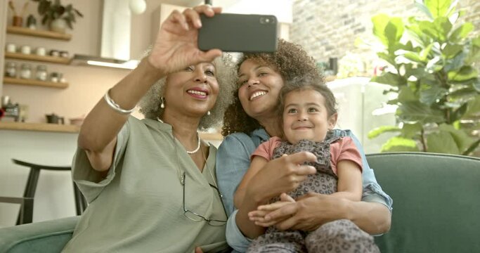 Three generations of family taking a selfie