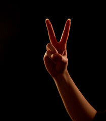 woman holding two fingers up
