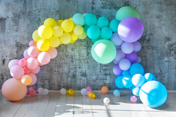 An arch of colored balloons on a holiday. Copy space for text
