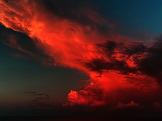 Fiery red clouds on the night sunset sky 