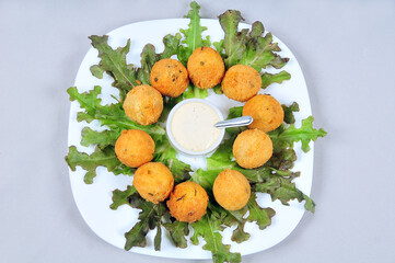 delicious fried bacalhau potato and cassava dumpling, baked and stuffed with chicken, cheese, olives and cream, kieve