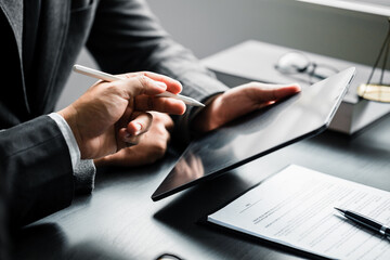 Close up of businessman or lawyers discussing about contract or  business agreement at law firm...