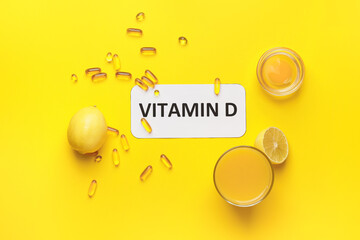Text VITAMIN D and different healthy products on yellow background
