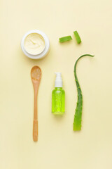 Different cosmetic products with aloe on light background