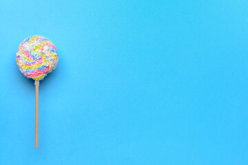 Sweet lollipop on color background