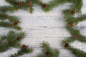 Christmas background with branches of fir, empty copy space in the middle