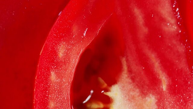 Beautiful red slice tomato. Tilt down.