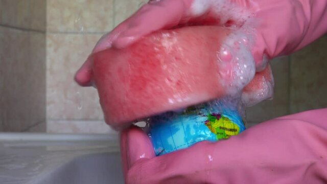 Washing of the mock-up of the eath or world. The concept of a healthier world, purification of the environment.