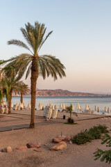 Beach scene with shade umbrellas in Eilat, Israel
