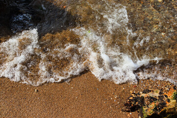 the wave washes the shore of the beach. sea ​​waves. waves in the sand. sea ​​beach. beach shore
